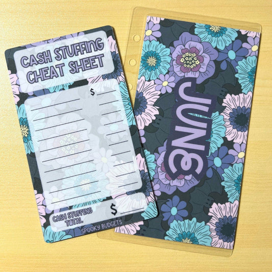 May include: A cash stuffing cheat sheet and a June floral calendar. The cheat sheet is a white sheet with black text that reads &#39;Cash Stuffing Cheat Sheet&#39;. The sheet has lines for writing numbers and a section for writing a total. The June calendar is a floral design with purple, blue, and pink flowers on a black background. The text &#39;June&#39; is written in white and is rotated 90 degrees.